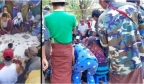缅甸小镇上百人围着赌博，现场100多辆摩托车，赌资堆成堆